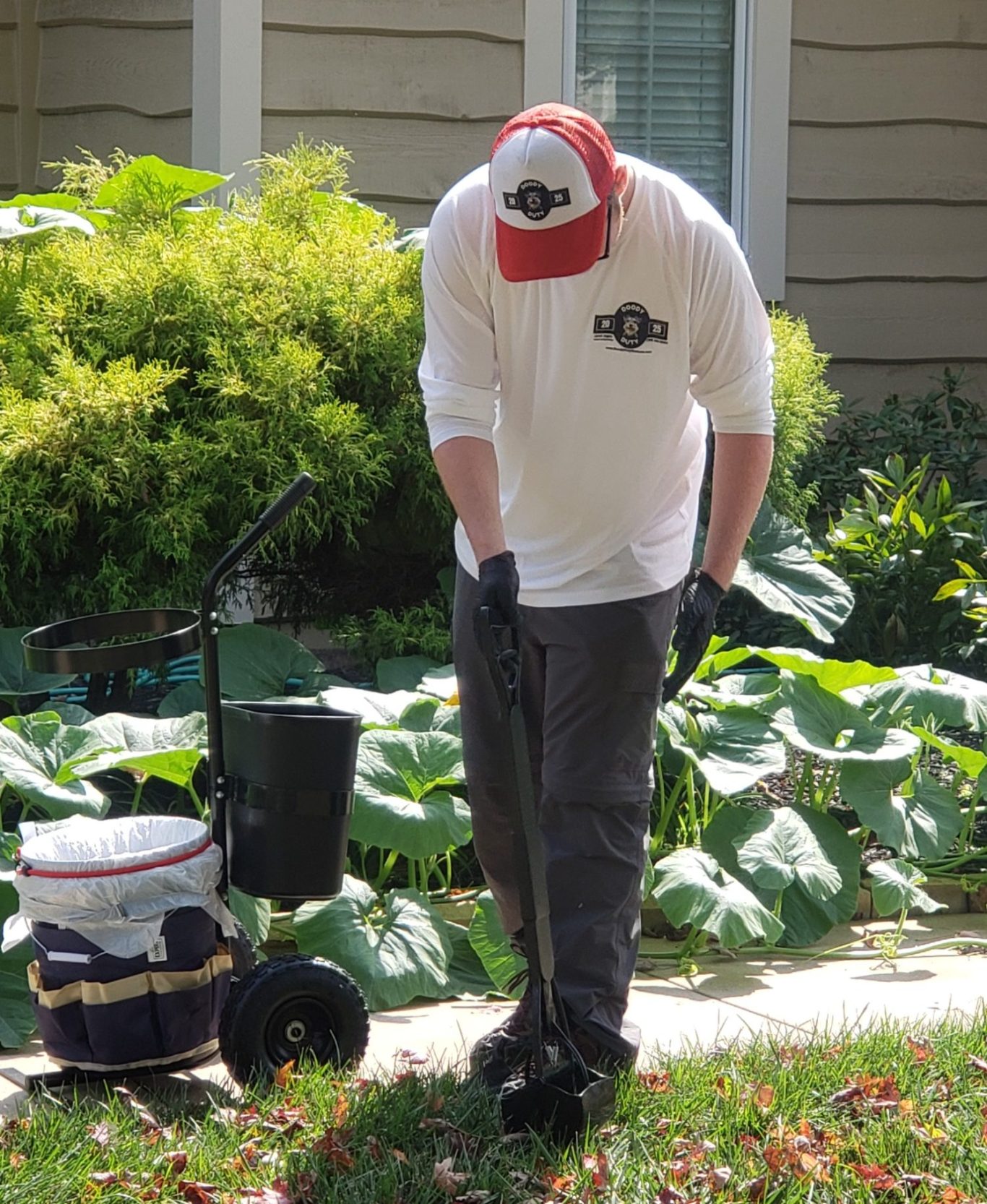 Doody Duty in Lawrence KS Pooper scooper service cleaning pet waste from a residential yard